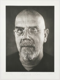 Self-portrait/photogravure by Chuck Close at Graphicstudio