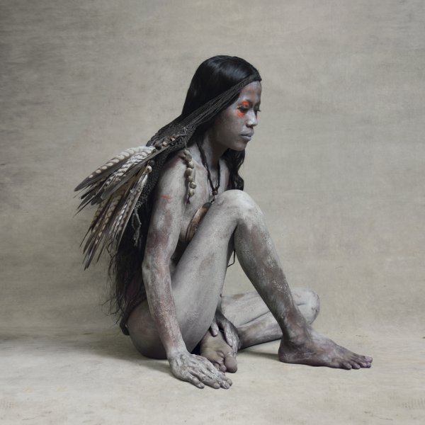 Young Woman With Falcon Feather Bag, New Guinea by Fred Stichnoth