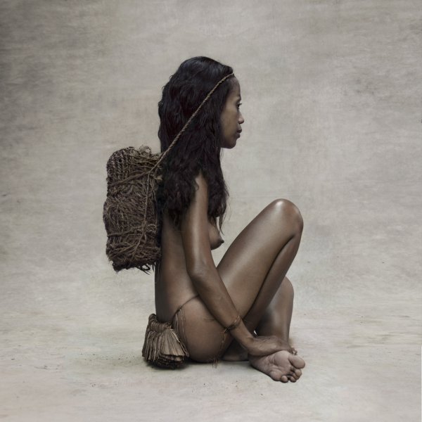 Young Woman With Coconut Rope, New Guinea by Fred Stichnoth