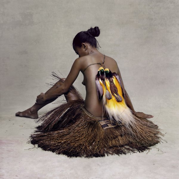 Young Woman With Paradise Birds, New Guinea by Fred Stichnoth