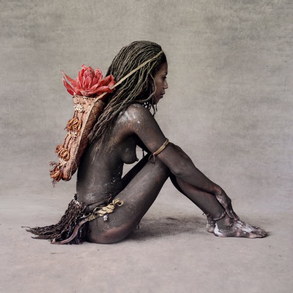 Young Woman With Red Ginger Flower, New Guinea by Fred Stichnoth