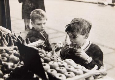 Untitled (Child with Toffee Apple and Gun) by Bert Hardy at Osborne Samuel Gallery