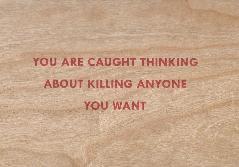 You Are Caught Thinking About Killing Anyone You Want Wooden Postcard [Red Text] by Jenny Holzer